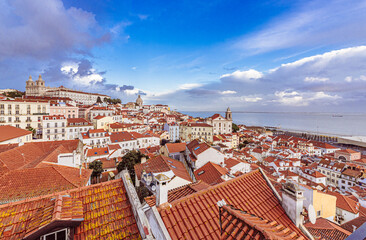 Obraz premium Travelling in Lisbon, Portugal. World digital nomad style living with stunning view, good wine and amazing culinary scene. 