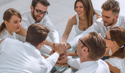 Fototapeta premium business team is making a tower out of hand