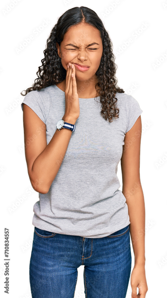 Wall mural Young african american girl wearing casual clothes touching mouth with hand with painful expression because of toothache or dental illness on teeth. dentist