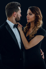 A young man and a woman looking each other