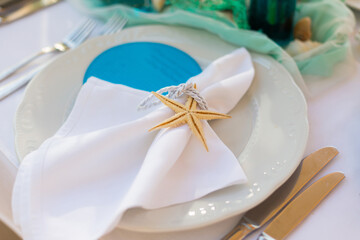 decorated table in the restaurant for a wedding dinner