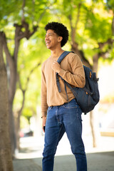 African American student stands outdoors