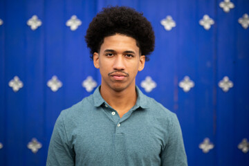 serious young man with afro