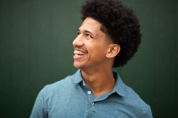 happy young man with afro smiling