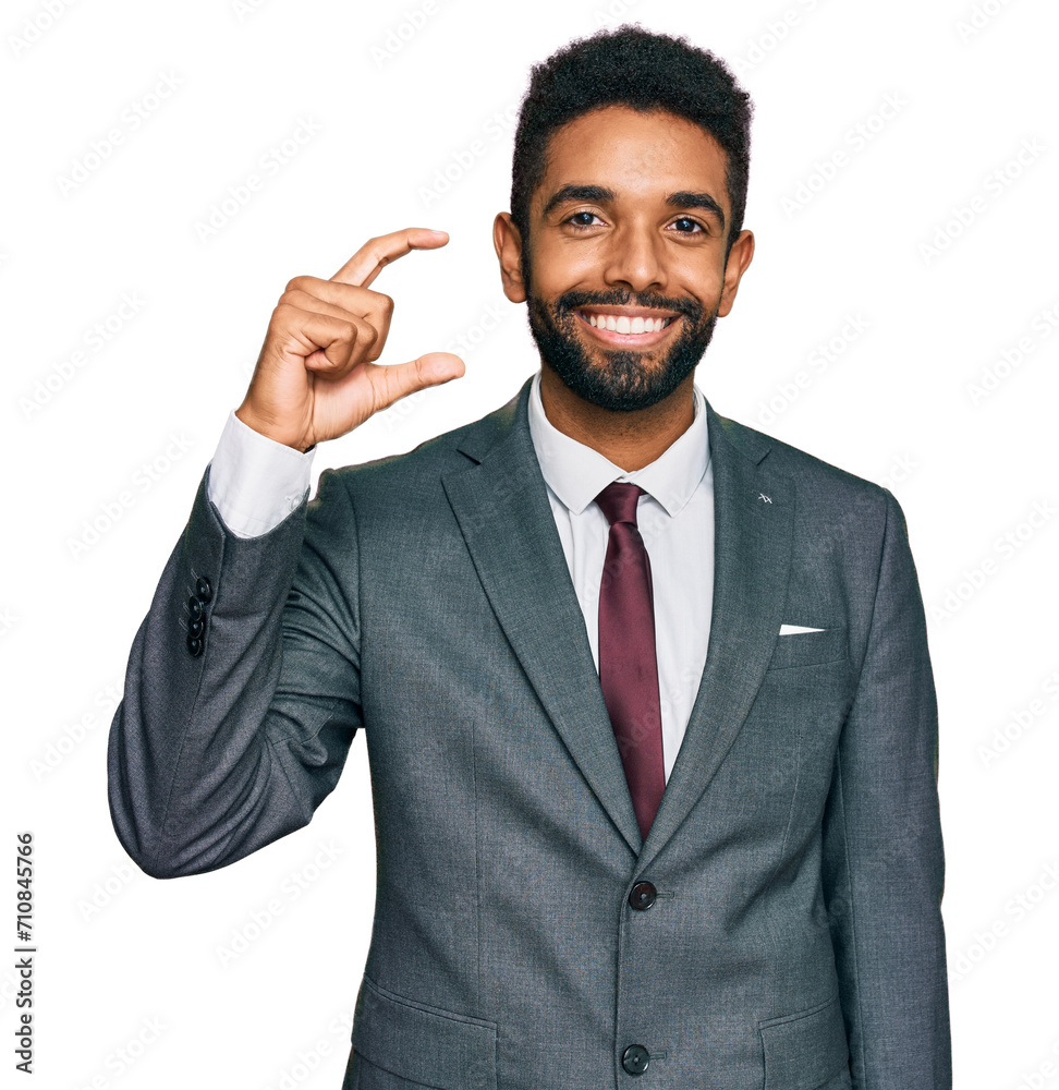 Poster Young african american man wearing business clothes smiling and confident gesturing with hand doing small size sign with fingers looking and the camera. measure concept.