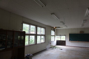 abandoned school building crumbling away with interior still inside