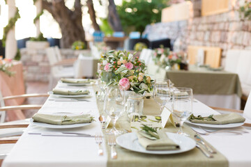 decorated table in the restaurant for a wedding dinner