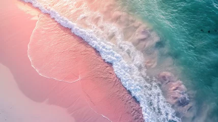 Deurstickers Stunning top view from a drone: beautiful pink beach waves of sea water hitting the sand on the shore. Atmospheric ocean landscape © ТаtyanaGG