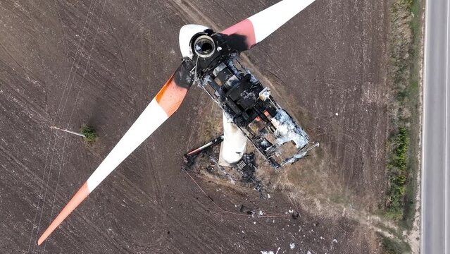 Close-up of a burnt out wind turbine. Wind energy farm turbine destroyed, damaged by fire after a lightning strike. Windmill, energy production