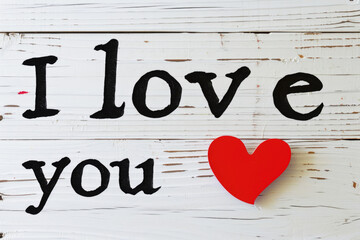 I love you text with red heart on white wooden background, Valentines day concept