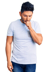 Fototapeta premium Handsome latin american young man wearing casual clothes feeling unwell and coughing as symptom for cold or bronchitis. health care concept.