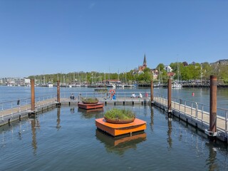 Fototapeta premium Along the street in Flensburg harbor with old boats, Flensburg, Germany