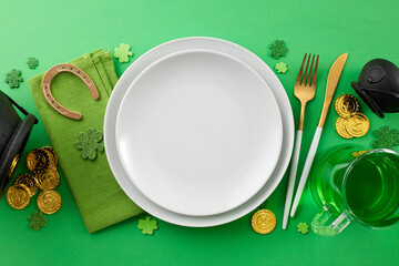 Setting the table for St. Paddy's celebration. Top view photo of plates, cutlery, napkin,...