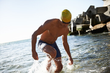 Beach sports, fitness and man for swimming training, workout or exercise in sea, nature and island....