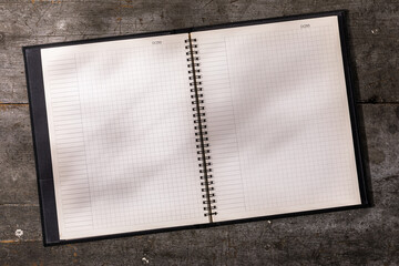 Blank notebook with grid pages

