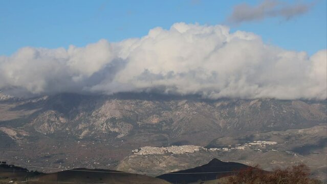Palermo, Sicily, Italy Clouds moving across the Sicilian mountain and the city of Alia
