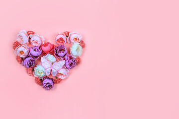Floral heart with butterflies on pink background.Concept for Valentine's Day or Women's Day,...