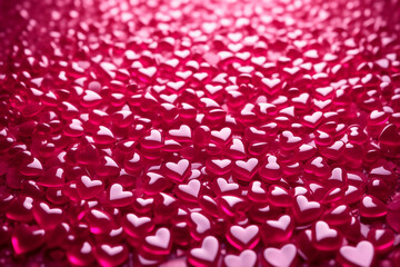 Background of voluminous pink hearts, texture of glass hearts. Valentine's Day Background