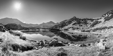 Black and white panorama of the Muratovo lake. This is the popular tourist destination in Pirin...