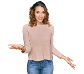 Beautiful young caucasian woman wearing casual sweater smiling cheerful with open arms as friendly welcome, positive and confident greetings