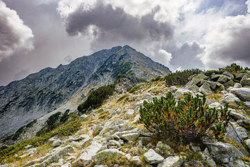 Stormy clouds above Todorka summit in summer. Mountain landscape in Pirin mountains, Bulgaria.