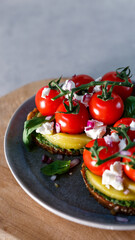 A Gourmet Vegetarian Feast Featuring Fresh Tomatoes and Avocado on a Rustic Table