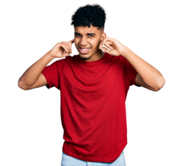 Young african american man wearing casual red t shirt covering ears with fingers with annoyed expression for the noise of loud music. deaf concept.