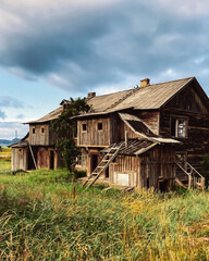 Abandoned wooden old rural house. Deserted country village, desolation and ruin