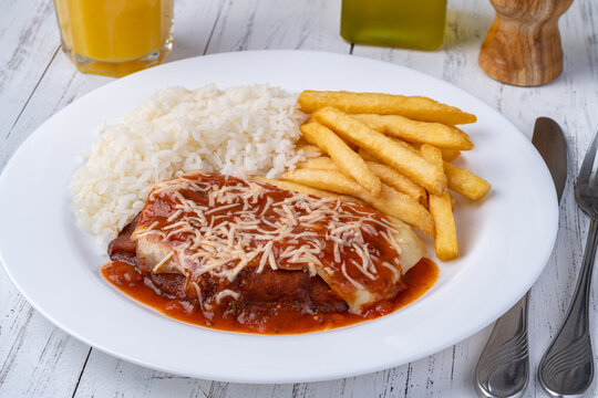Parmegiana beef, rice and french fries. Typical brazilian executive dish