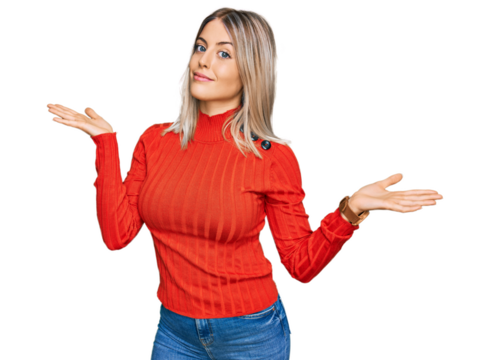 Beautiful blonde woman wearing casual clothes clueless and confused expression with arms and hands raised. doubt concept.