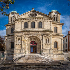 Fototapeta na wymiar Paris, France - 11 11 2023: Flandres district. View the facade of the Church of Saint-Jacques-Saint-Christophe from Square Serge Reggiani .