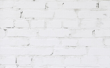 White rough brick wall texture. Old brick wall with white cracked paint.  Abstract white brick wall background for design. Close up.