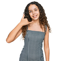 Teenager hispanic girl wearing casual clothes smiling doing phone gesture with hand and fingers like talking on the telephone. communicating concepts.