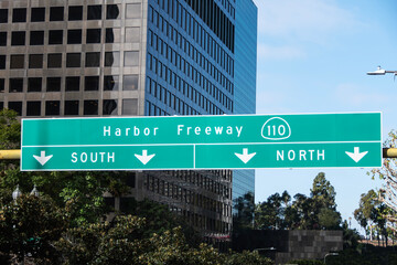 View of the Harbor 110 Freeway entrance sign on 5th street in downtown Los Angeles California.