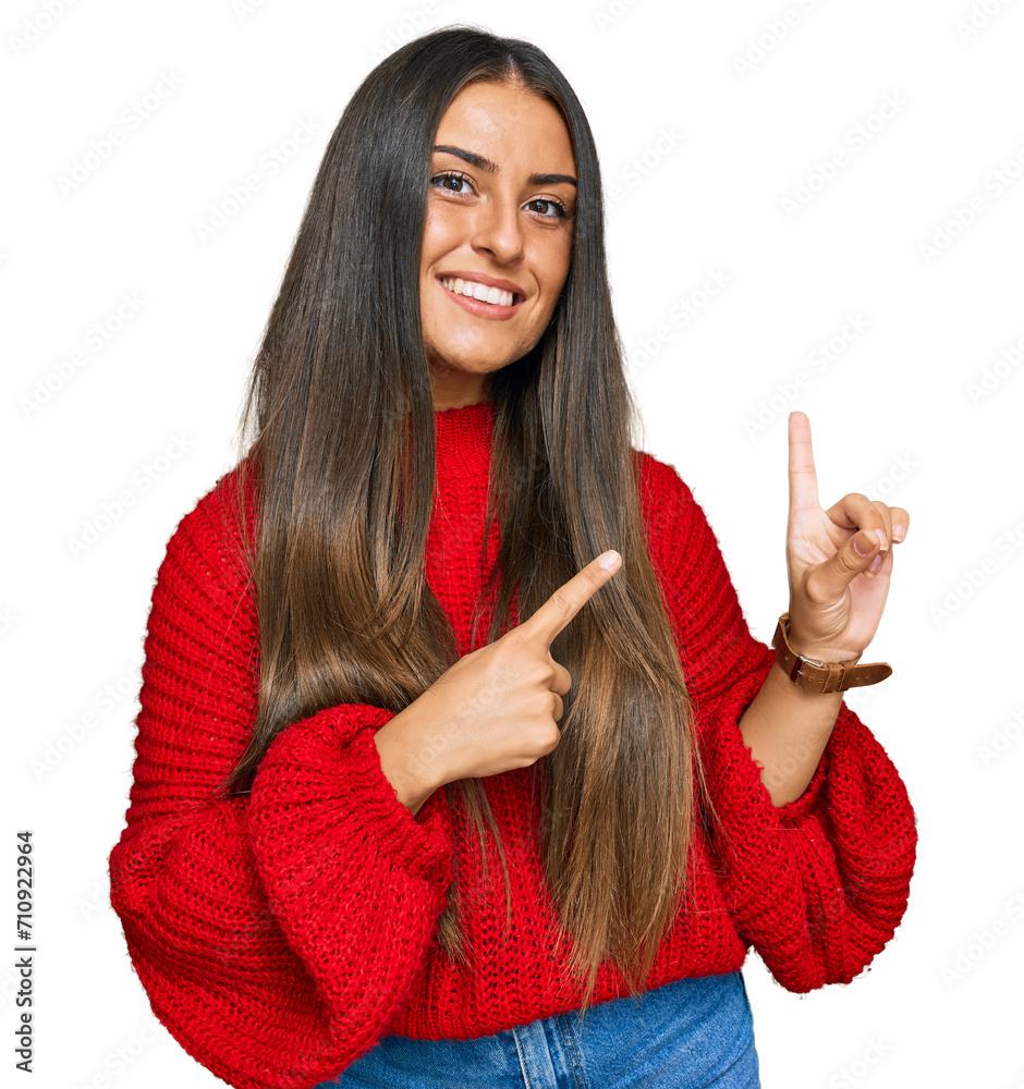 Wall mural beautiful hispanic woman wearing casual clothes smiling and looking at the camera pointing with two 