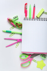 Blank notebook with different stationery isolated on white background