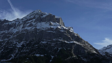 View of Swiss mountain peak with snow and sky