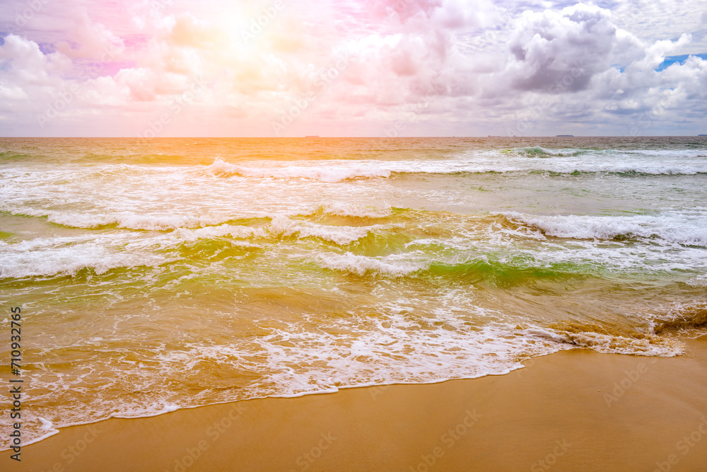 Poster Bright sunrise over ocean waves.