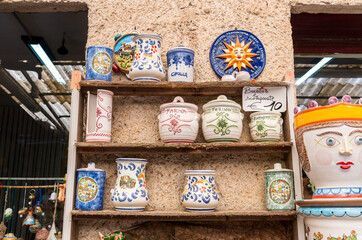 Traditional Sicilian handmade ceramic pottery products in typical souvenir shop in the historic center of Erici, province of Trapani, Western Sicily, Italy