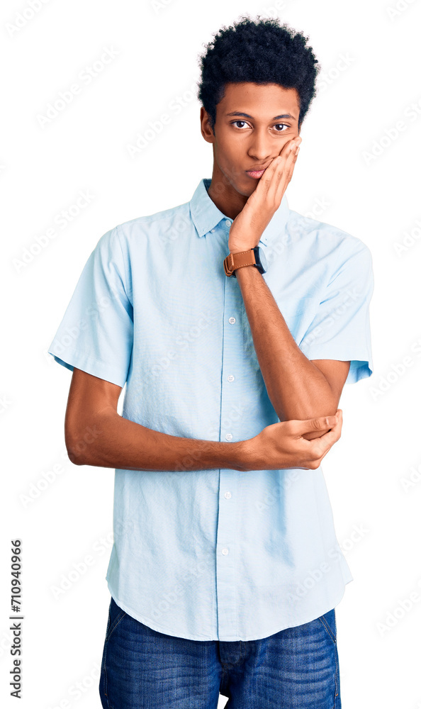 Wall mural young african american man wearing casual clothes thinking looking tired and bored with depression p