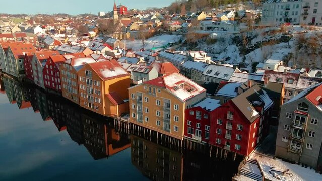 Colorful old houses at the nidelva river embankment in the center of trondheim old town, norway. 