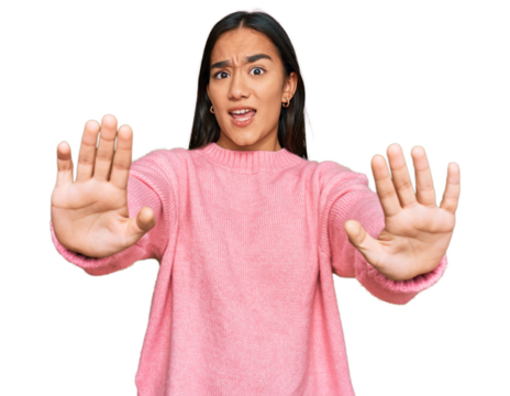 Young asian woman wearing casual winter sweater doing stop gesture with hands palms, angry and frustration expression - Powered by Adobe