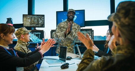 African American man, young head in army finishing military conference at office with screens and...
