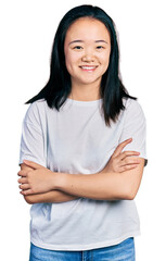 Young chinese woman wearing casual white t shirt happy face smiling with crossed arms looking at the camera. positive person.