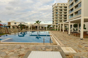Swimming pool with blue water in a residential complex 2