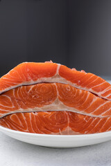 fresh, delicious salmon fillet on a white plate