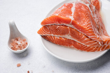 fresh, delicious salmon fillet on a white plate