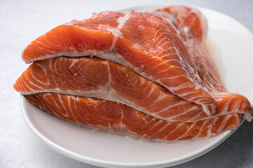 fresh, delicious salmon fillet on a white plate