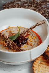 Mushroom cream soup on dark background. Champignon soup