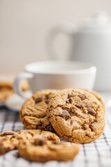 Sweet chocolate cookies on checkered napkin.